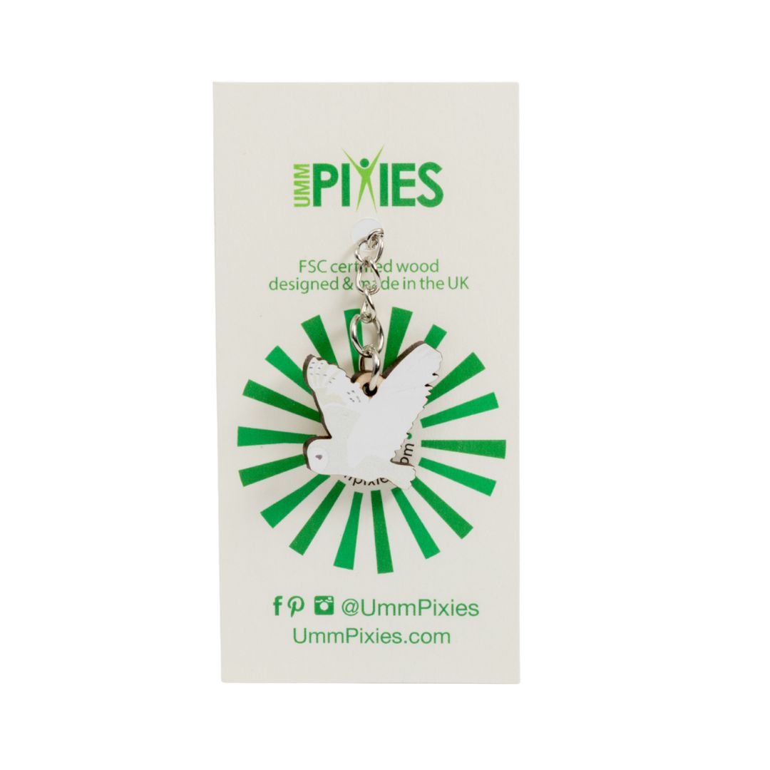 Umm Pixies Barn Owl in flight wooden charm on a branded card with green and white design
