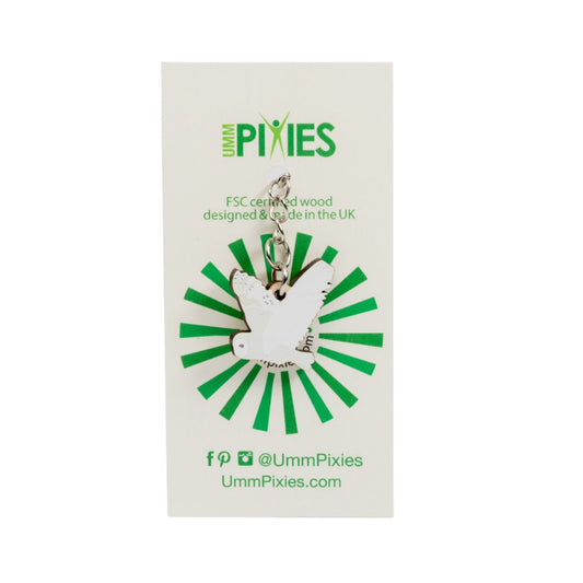 Umm Pixies Barn Owl in flight wooden charm on a branded card with green and white design