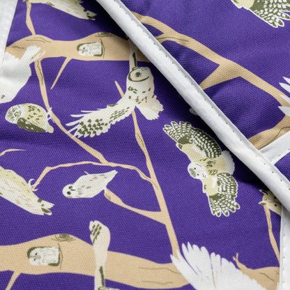 Close up details of the purple oven gloves with pattern featuring the  5 species of native British owl.