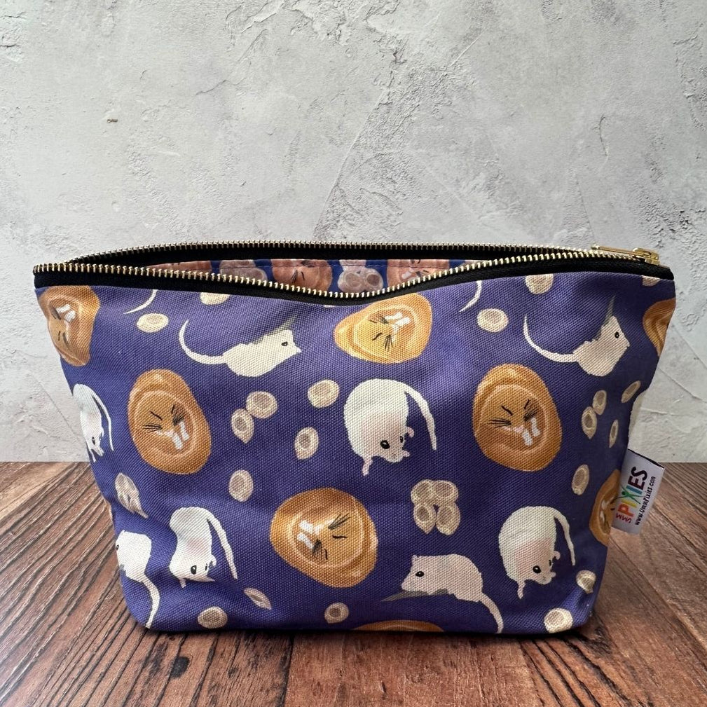 Purple Dormouse illustrated really useful bag shown with zip open and part of waterproof printed lining visible 