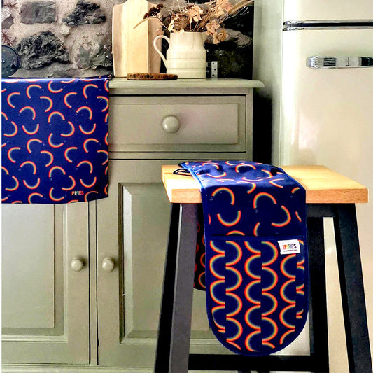 organic cotton rainbow tea towel and oven gloves. designed and made in Britain