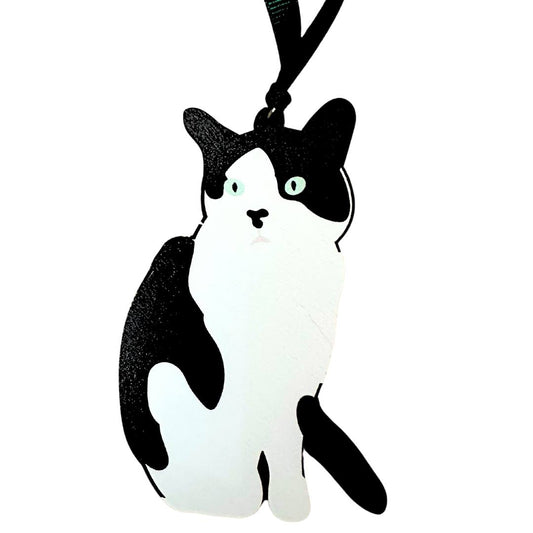 Black and white cat-shaped wooden hanging decoration shown on a white background