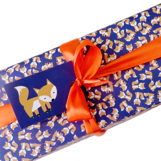 Gift wrapped in UmmPixies purple fox wrapping paper and tag