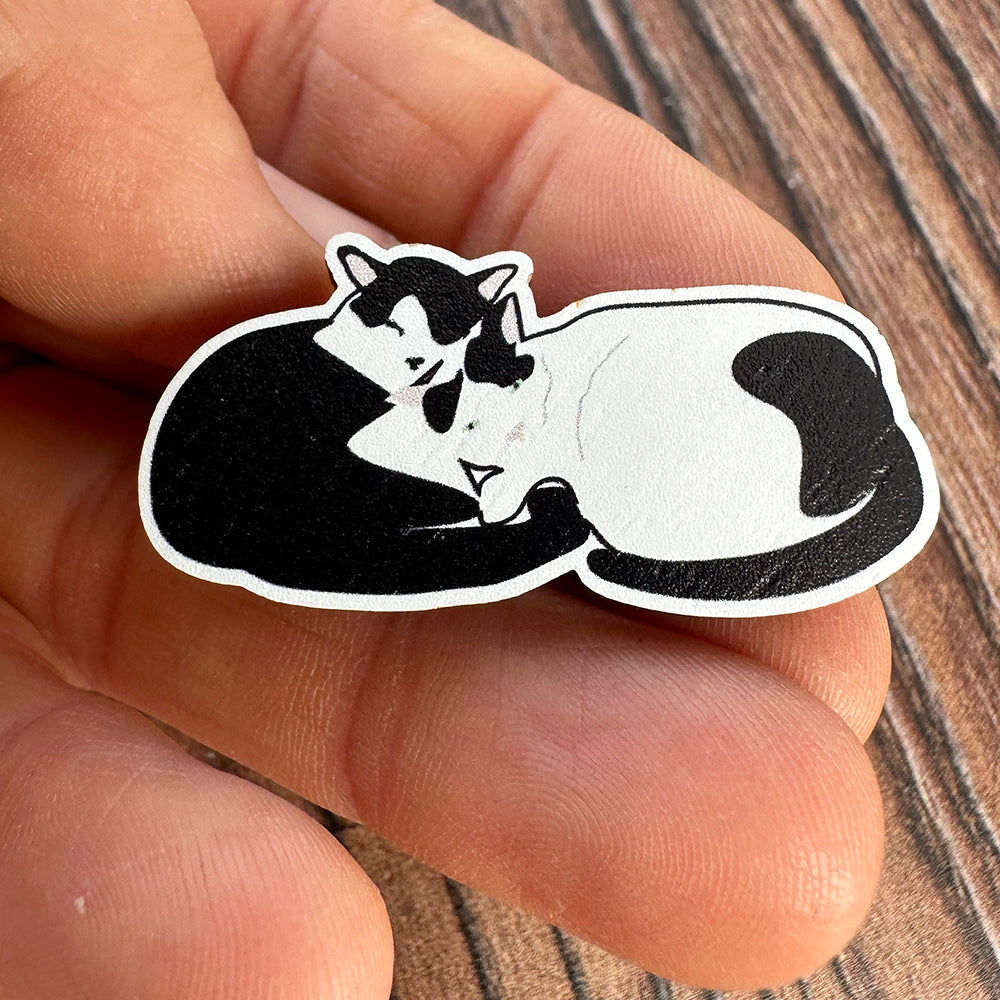 UmmPixies Curled Up Cats Wooden Pin Badge shown held in hand
