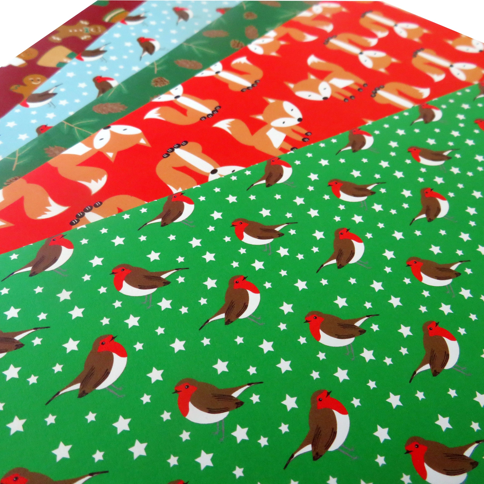 Christmas gift wrap selection from UmmPixies showing green robins design at top of the pile